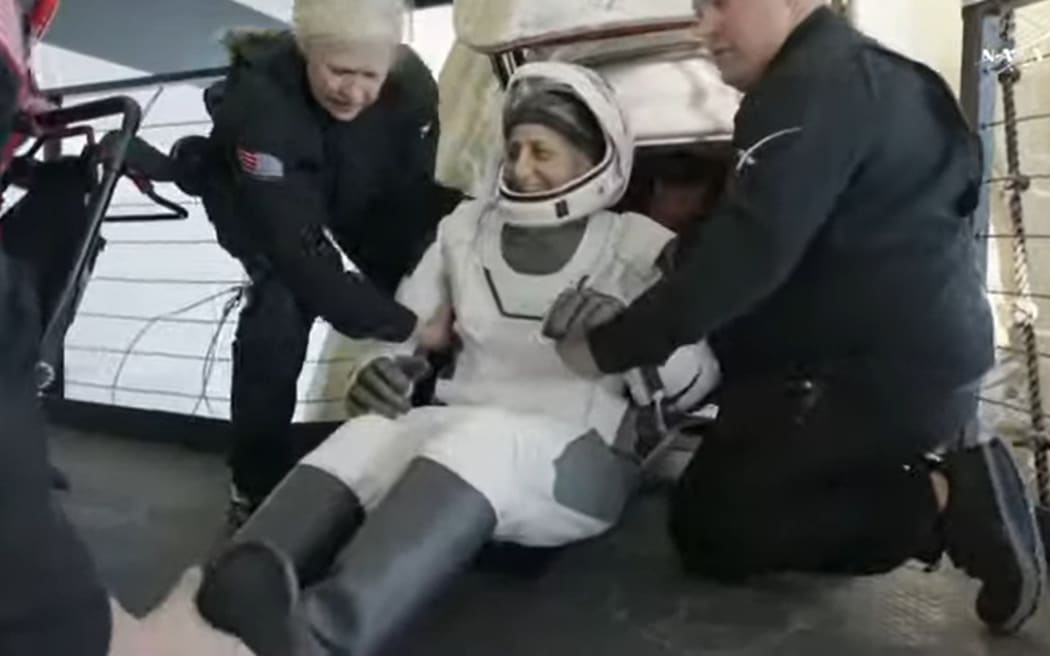 Suni Williams is wheeled out of the SpaceX pod and onto the recovery vessel