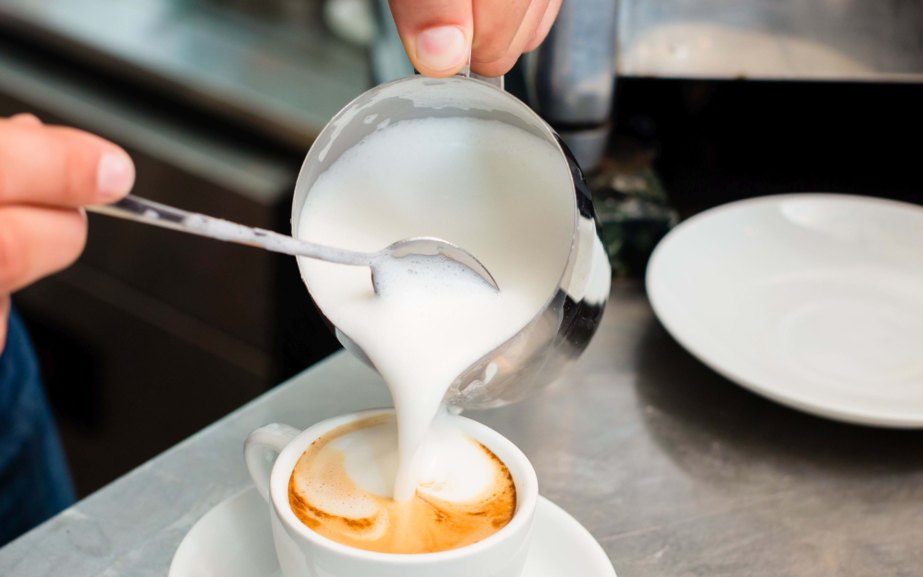 Barista preparing a cappuccino