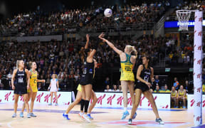 Silver Ferns player Maria Folau shoots against Australia.