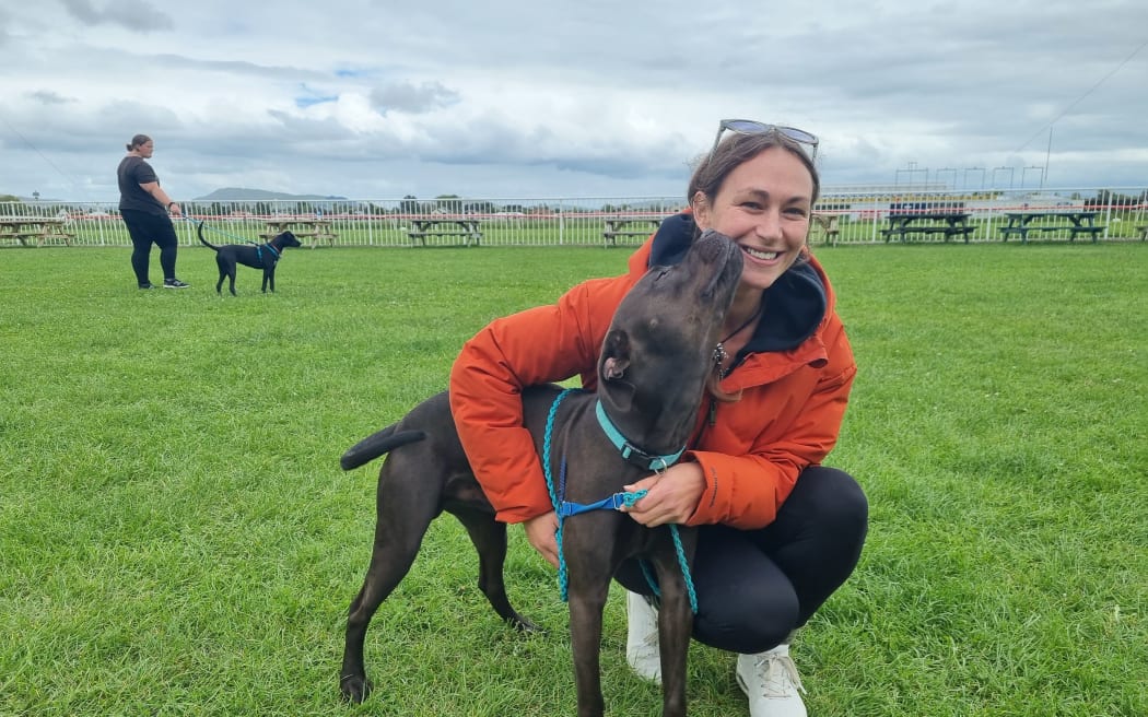 Christchurch resident Laura and a dog she has been walking.