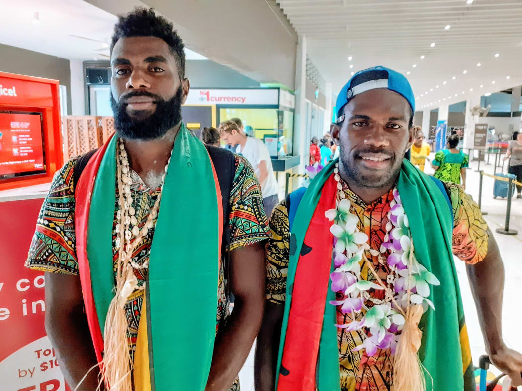 Luigi Teilemb and Rillio Rio Rii arriving home after their success at the World Rowing Coastal Championships.