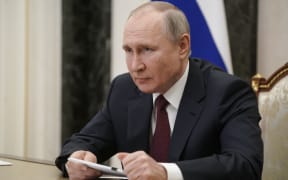 Russian President Vladimir Putin attends a meeting on social and economic development of Crimea and Sevastopol, via teleconference call, at the Kremlin in Moscow, Russia.