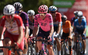 Team Education First's New Zealand rider Tom Scully (C) rides in Cordoba during the 12th stage of the 2021 La Vuelta cycling tour of Spain, a 175 km race from Jaen to Cordoba, on August 26, 2021.