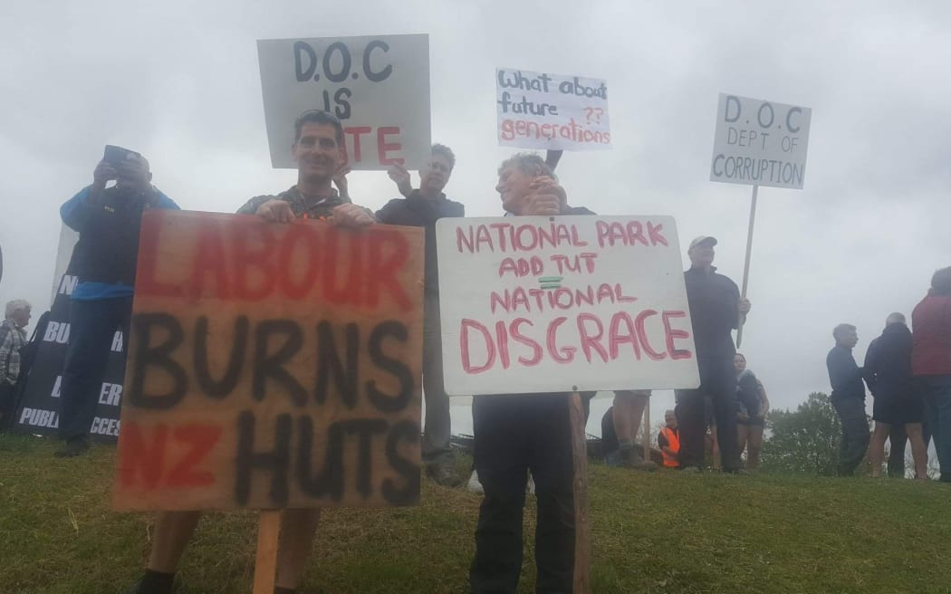 About 200 people gathered in Tāneatua to protest the removal of Te Urewera Department of Conservation backcountry huts.