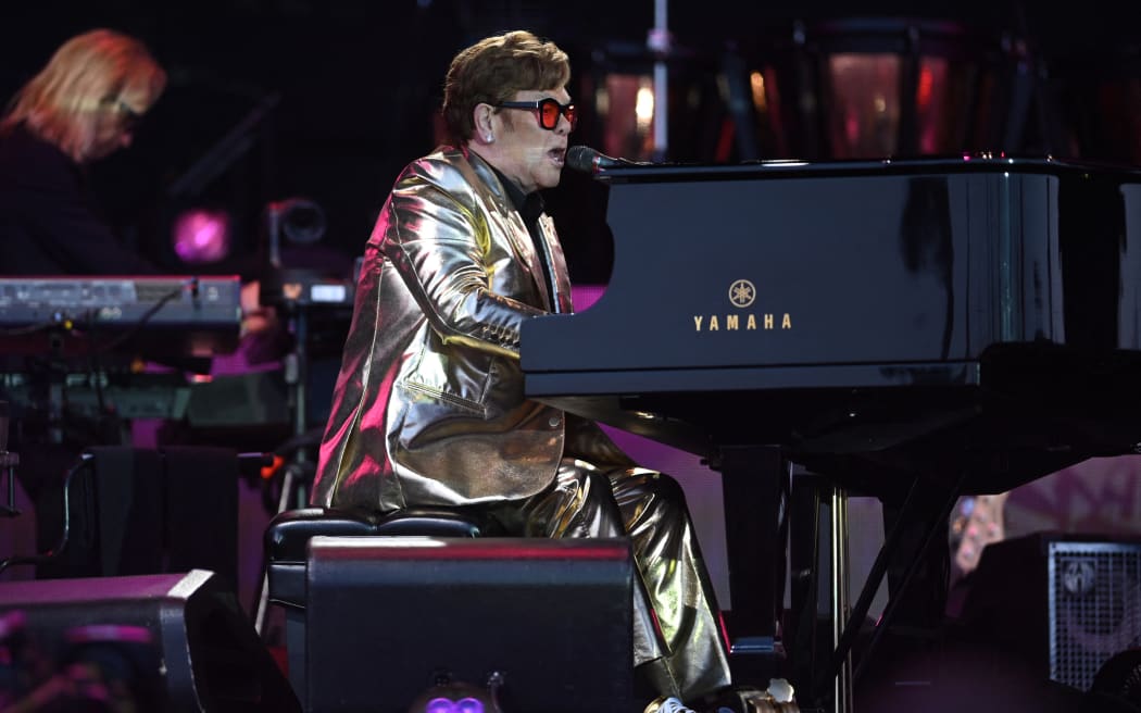 British legendary singer Elton John performs on the Pyramid Stage on day 5 of the Glastonbury festival in the village of Pilton in Somerset, southwest England, on June 25, 2023. Elton John closes out Britain's legendary Glastonbury Festival on Sunday in what has been billed as his final UK performance. The 76-year-old pop superstar is winding down a glittering live career with a global farewell tour, having played his last concerts in the United States in May ahead of a final gig in Stockholm on July 8. (Photo by Oli SCARFF / AFP)