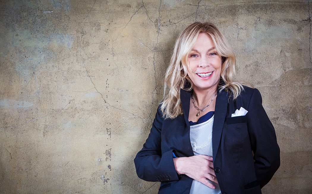 Singer Rickie Lee Jones, concrete wall background