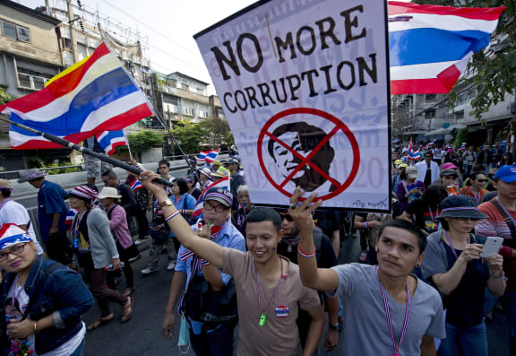 A rally in Bangkok a day after a bomb attack that killed one and left dozens injured.