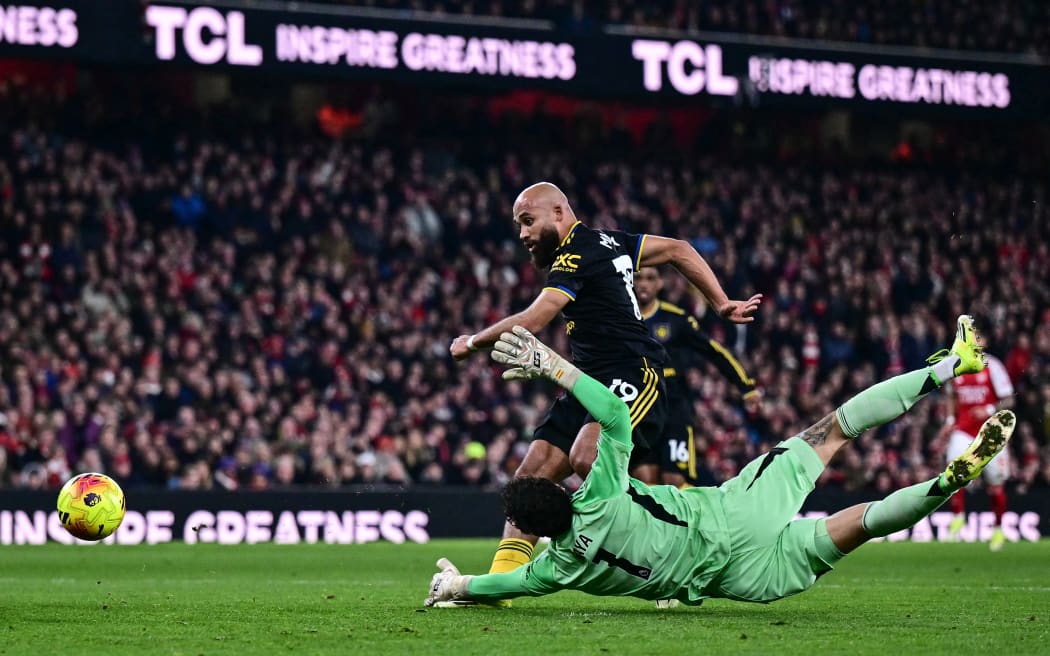 Manchester United's Bryan Mbeumo scores against Arsenal.