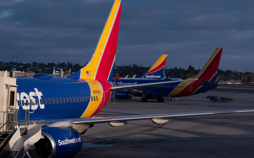 Southwest Airlines Boeing 737s are lined up at the terminal at San Diego International Airport in August 2024.