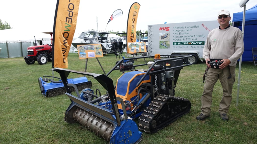 Xaver Fruehschuetz, from Slopemowing, with his remote control mower.