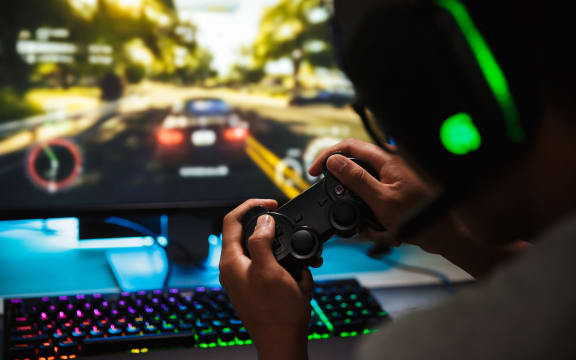 Teenager playing video games online.