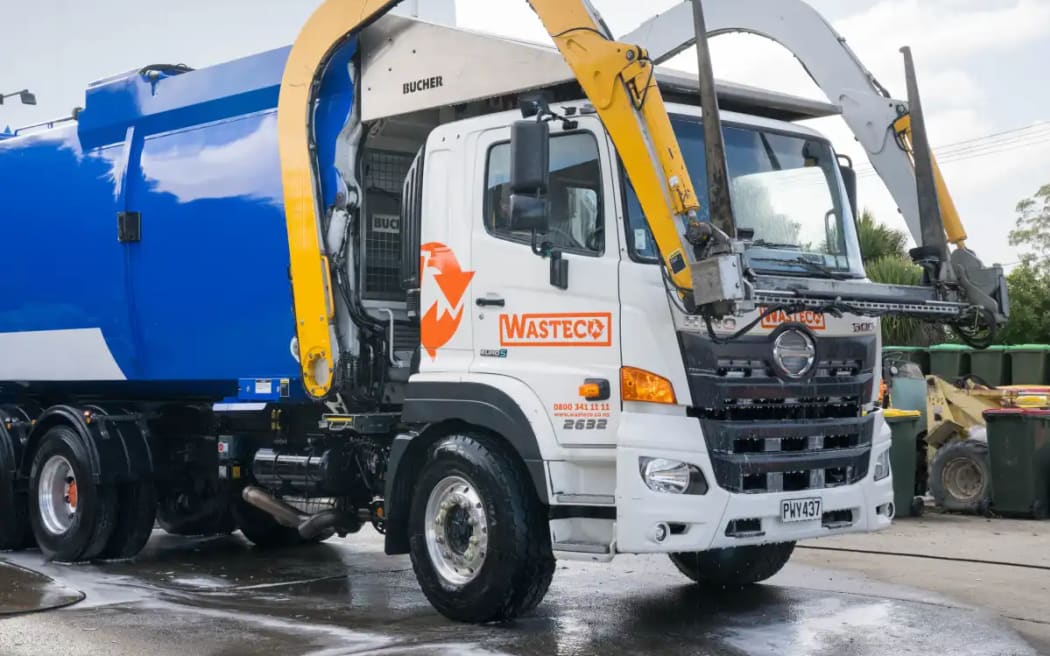 One of WasteCo’s front-load skips trucks.