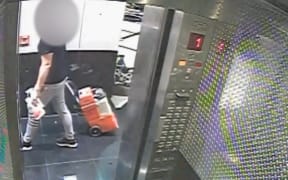 CCTV footage of the defendant in the Grace Millane murder trial with a rug doctor he hired.