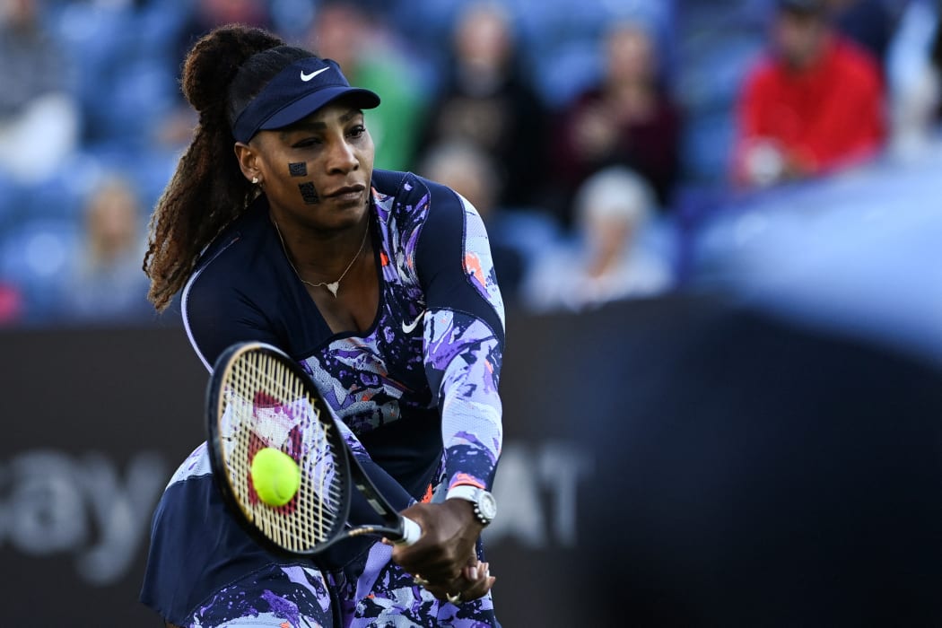 Serena Williams of the US, playing with Tunisia's Ons Jabeur, returns the ball to Japan's Shuko Aoyama and Taiwan's Chan Hao-ching during their women's doubles quarter final tennis match on day four of the Eastbourne International tennis tournament in Eastbourne, southern England on June 22, 2022. (Photo by Glyn KIRK / AFP)