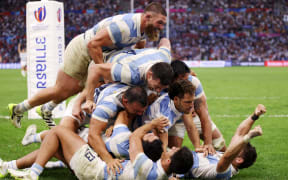 Nicolas Sanchez of Argentina celebrates with teammates after scoring the team's second try during the Rugby World Cup France 2023 Quarter Final match between Wales and Argentina at Stade Velodrome