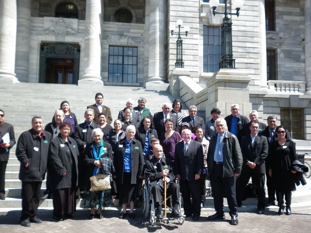 Tribal and parliamentary officials pose after first reading of iwi settlement bills.