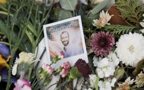 A picture at a makeshift memorial at the site where Alex Pretti was fatally shot in Minneapolis.