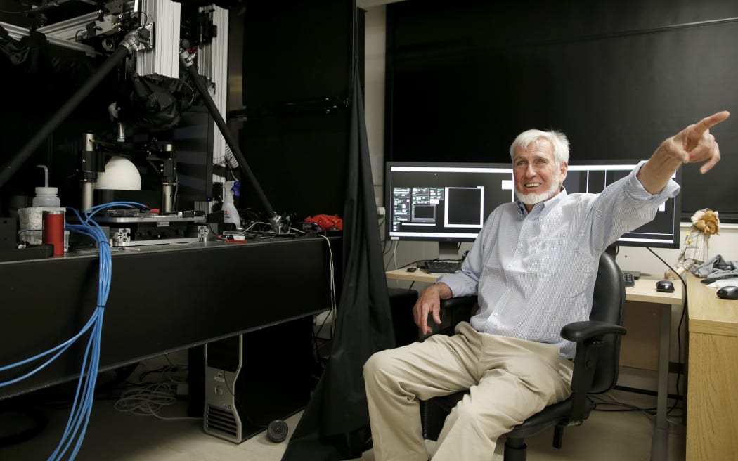 Professor John O'Keefe poses for pictures at his office in London after co-winning the Nobel Medicine prize.
