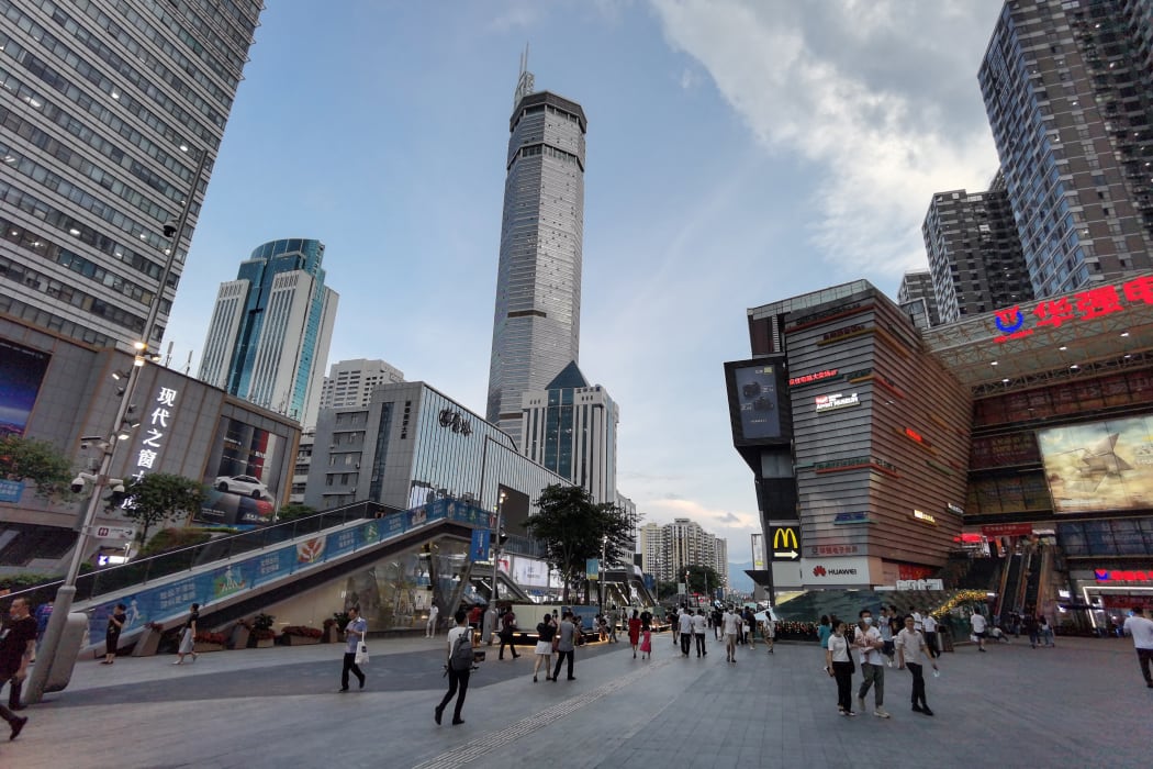 The 300m SEG Plaza building, centre, in Shenzhen, began to shake, sending shoppers fleeing, 18 May 2021.