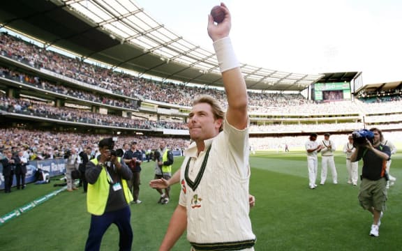 In this file photograph taken on December 28, 2006, Australian spinner Shane Warne waves to the crowd after playing his last Test Match on his home ground, the MCG, on the third day of the fourth cricket Test played in Melbourne.