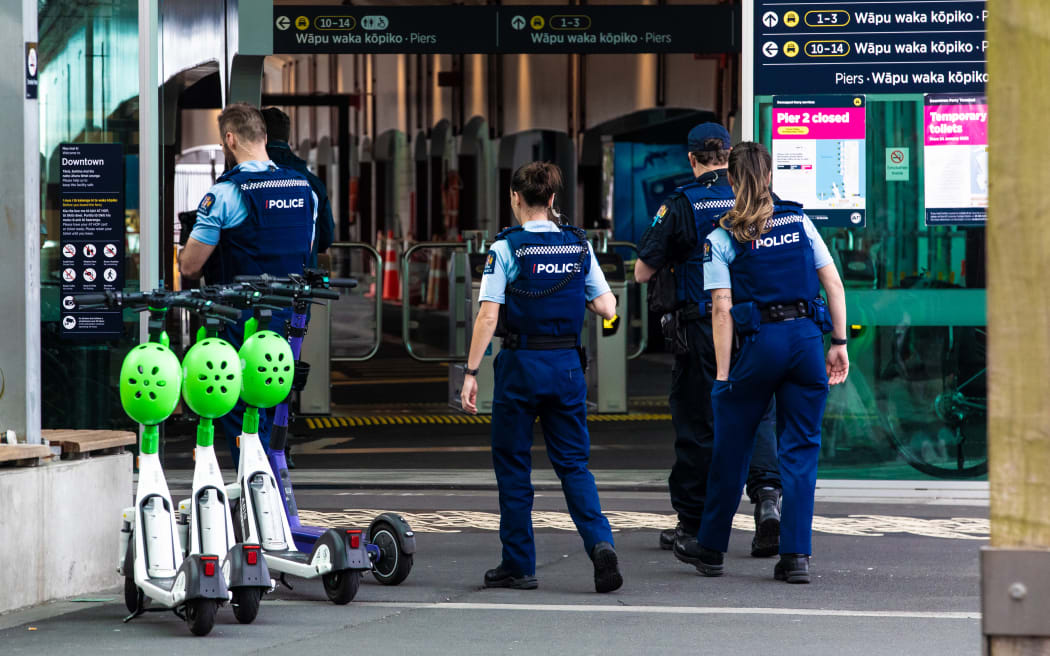 Police officers walk in Auckland CBD.