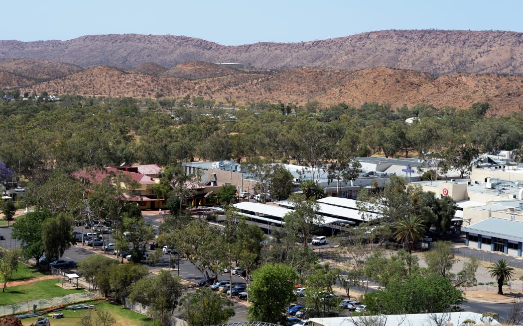 A view of the town of Alice Springs in Australia's Northern Territory state, popularly known as "the Alice" and straddling the usually dry Todd River on the northern side of the MacDonnell Ranges, is shown in this photo taken on October 13, 2013.  AFP PHOTO / GREG WOOD (Photo by GREG WOOD / AFP)