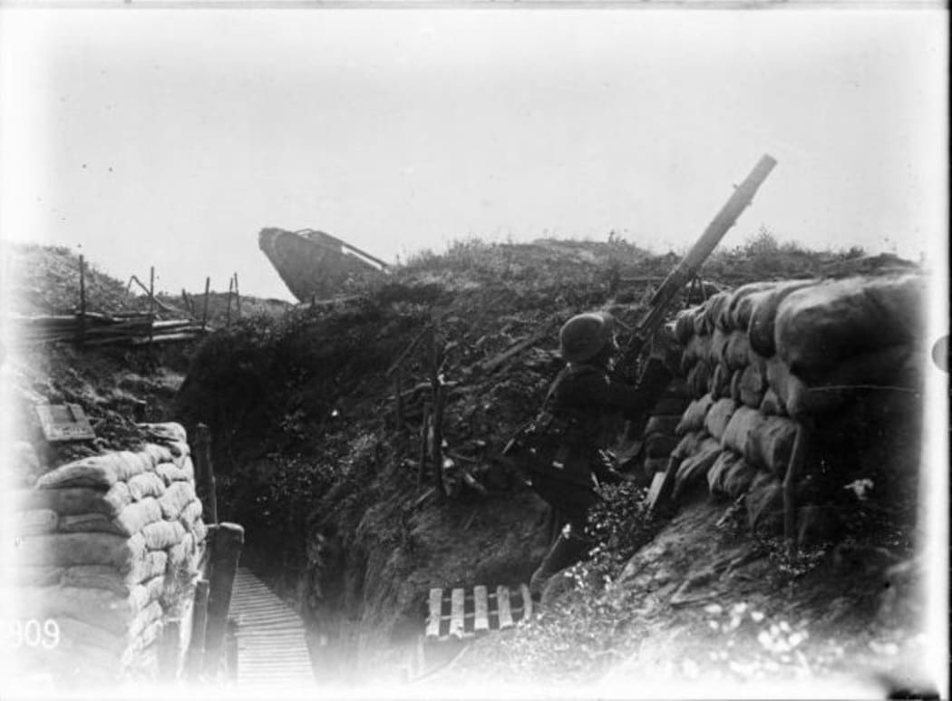 World War 1 New Zealand trench, Gommecourt, France, 10 August, 1918. An unidentified soldier is firing at an enemy plane.  http://natlib.govt.nz/records/22904135