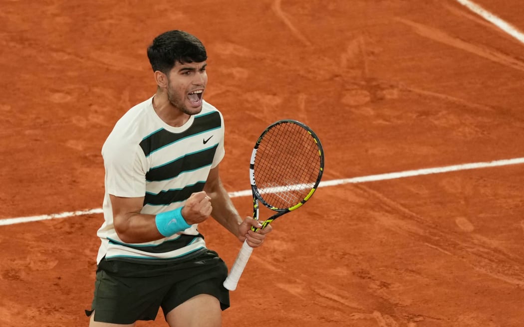 Spain's Carlos Alcaraz reacts to a point against as he plays against Italy's Lorenzo Musetti during their men's singles semi-final match on day 13 of the French Open tennis tournament on Court Philippe-Chatrier at the Roland-Garros Complex in Paris on June 6, 2025. (Photo by Dimitar DILKOFF / AFP)