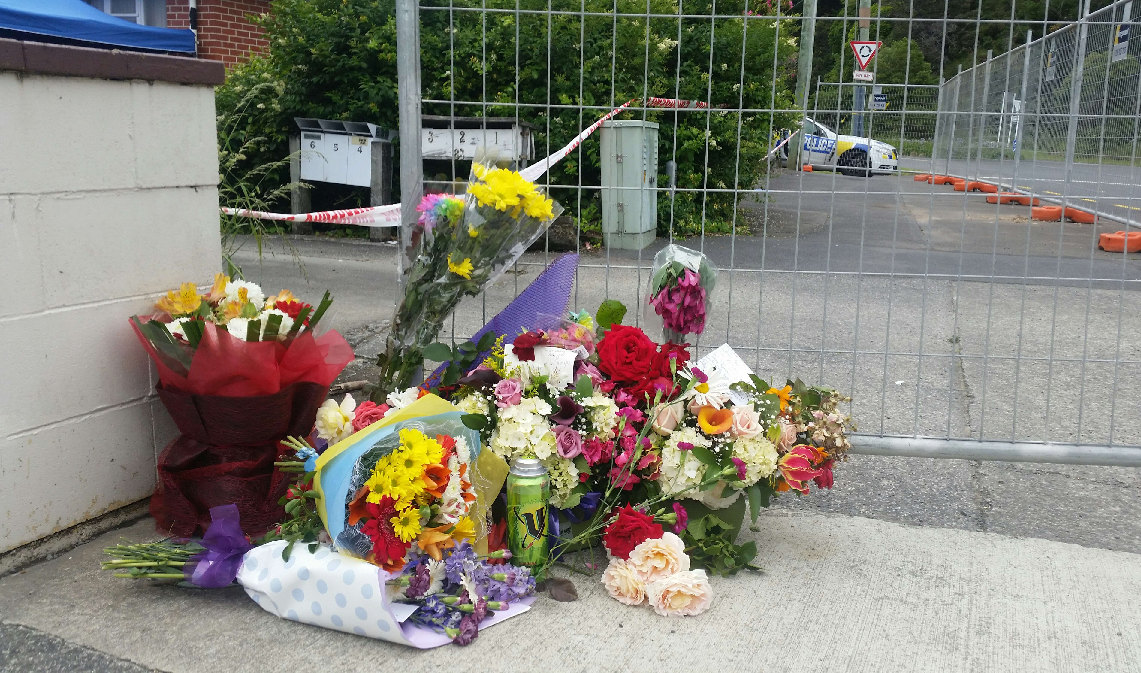 Flowers at the scene of the flat on Ward St in Upper Hutt where Lois Tolley, 30, was found dead early on Saturday.