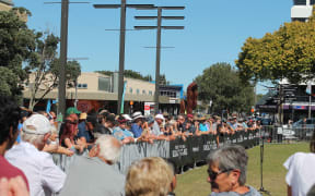 a crowd of onlookers watching the highlander champion tournament