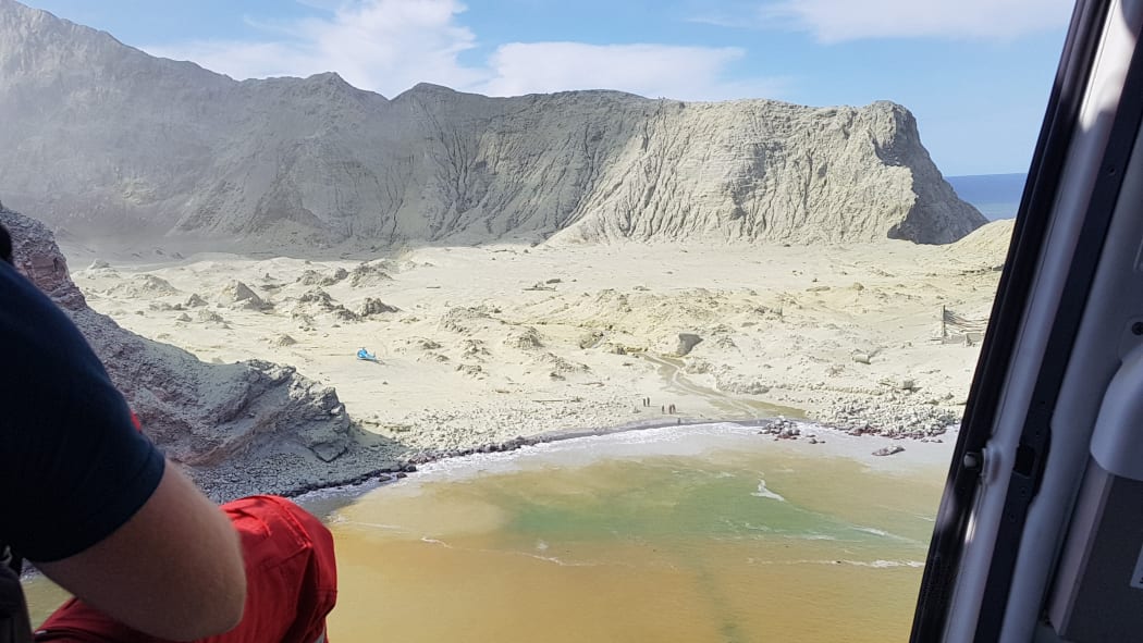 A helicopter assisting in the search and rescue operation at White Island.
