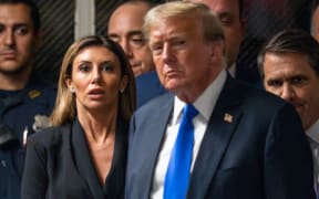 NEW YORK, NEW YORK - MAY 30: Attorney Alina Habba (L) looks on as former U.S. President Donald Trump walks to speak to the media after being found guilty following his hush money trial at Manhattan Criminal Court on May 30, 2024 in New York City. The former president was found guilty on all 34 felony counts of falsifying business records in the first of his criminal cases to go to trial. Trump has now become the first former U.S. president to be convicted of felony crimes.   Steven Hirsch-Pool/Getty Images/AFP (Photo by POOL / GETTY IMAGES NORTH AMERICA / Getty Images via AFP)