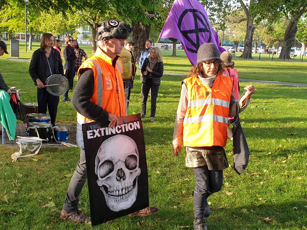 Extinction Rebellion activists stage a protest in Christchurch near the venue of the NZ Gas Forum.