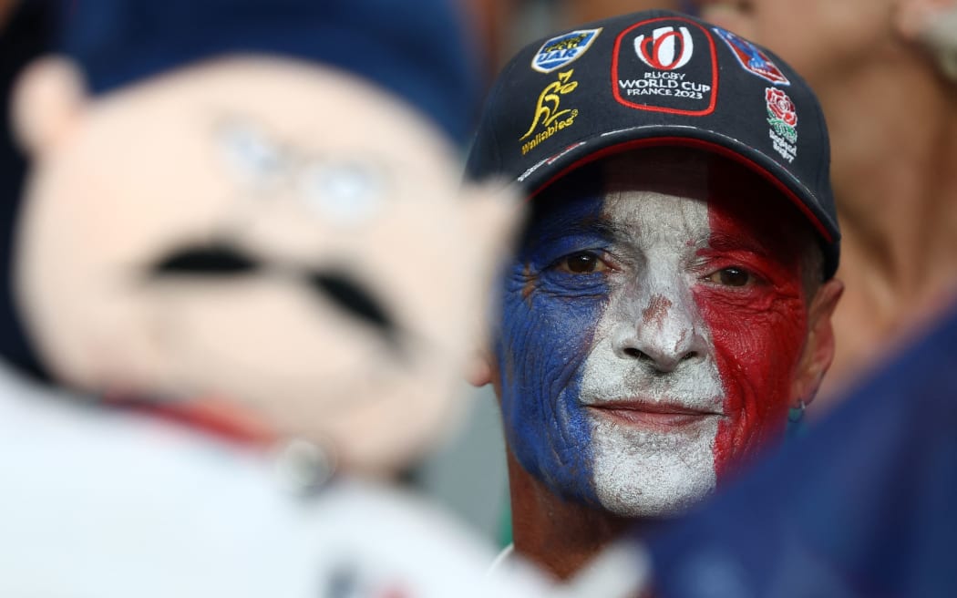 A spectator looks on ahead of the France 2023 Rugby World Cup Pool A match between France and New Zealand at the Stade de France in Saint-Denis, on the outskirts of Paris on September 8, 2023. (Photo by FRANCK FIFE / AFP)