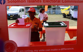 A student cast her ballot paper in the ballot box during the mock polling on 22 February 2024.