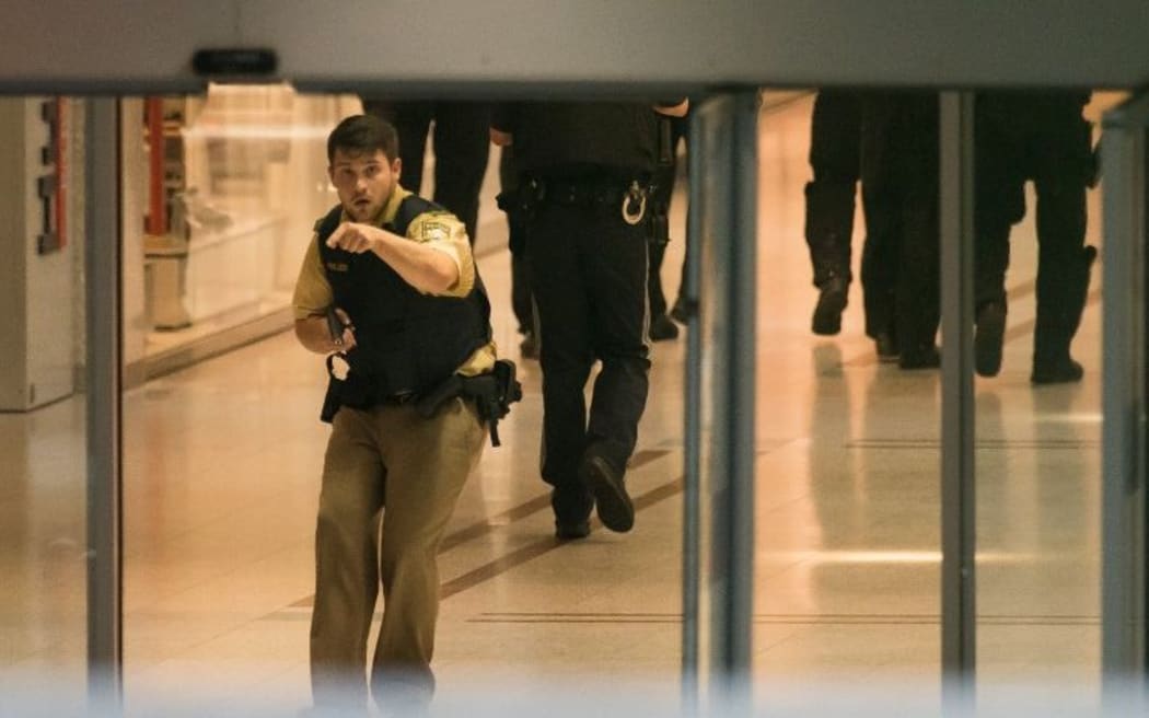 Police secures the area inside a shopping centre in Munich following the shooting.