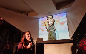 Prime Minister Jacinda Ardern reacts to the puppet caricature revealed at Wellington's Backbencer pub.