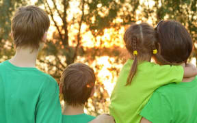 Woman and children in park (file photo)