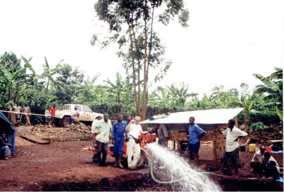 Bob Askew and IRC volunteers providing running water at the refugee camp in Democratic Republic of Congo