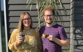 Jono Broom of Bean Merchant enjoys a cuppa with his partner Maddie Hullena.