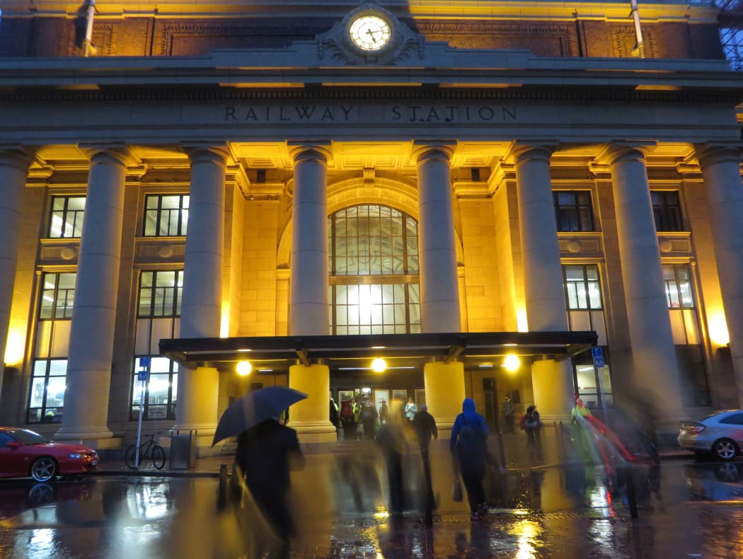 Commuters head into Wellington Railway Station.