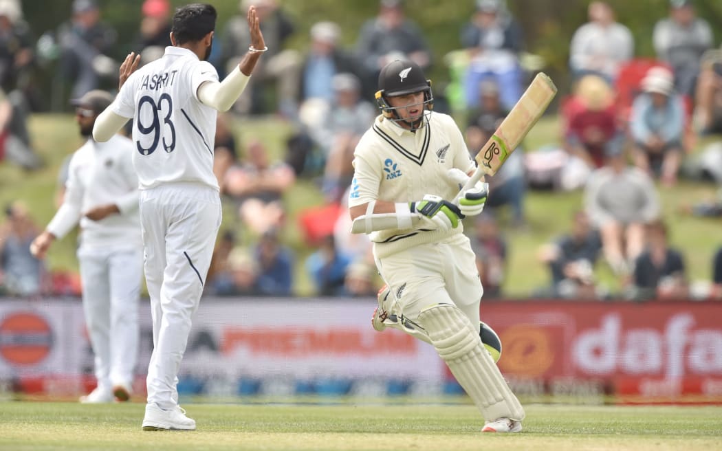 New Zealand's Tom Latham (R) makes runs on day three of the second Test cricket match between New Zealand and India at the Hagley Oval in Christchurch on March 2, 2020. (Photo by PETER PARKS / AFP)