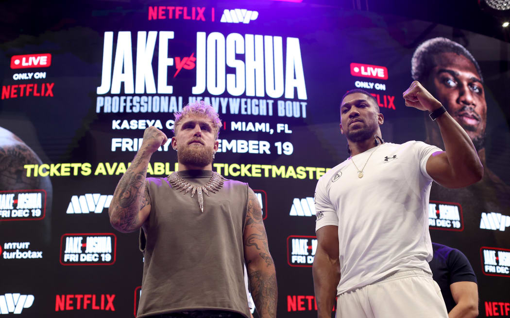 MIAMI, FLORIDA - NOVEMBER 21: Jake Paul and Anthony Joshua face off during the press conference about their exhibition match scheduled for December 19 at Kaseya Center on November 21, 2025 in Miami, Florida. (Photo by Leonardo Fernandez/Getty Images)