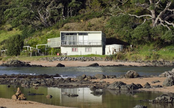 Remote bach holiday house on January 25 2013 in Cable bay, New Zealand. More than 50,000 baches exist around New Zealand