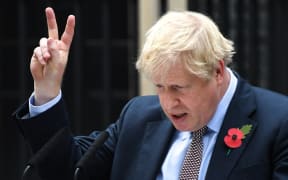 British Prime Minister Boris Johnson gestures as he addresses the nation at 10 Downing Street on November 6, 2019 in London, England.