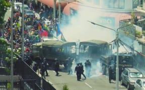Clashes between an estimated 500-strong crowd protesting against electoral roll changes and French police in downtown Nouméa on 21 February 2024.