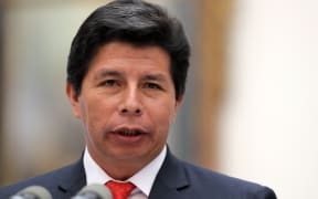 Peru's President Pedro Castillo speaks during a press conference with his Chilean counterpart Gabriel Boric (out of frame) at La Moneda presidential palace in Santiago, on November 29, 2022, during his visit to Chile. (Photo by JAVIER TORRES / AFP)
