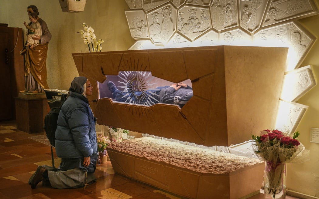 A nun prays at the tomb of Blessed Carlo Acutis in the Church of Santa Maria Maggiore in Assisi, Italy, on March 18.
