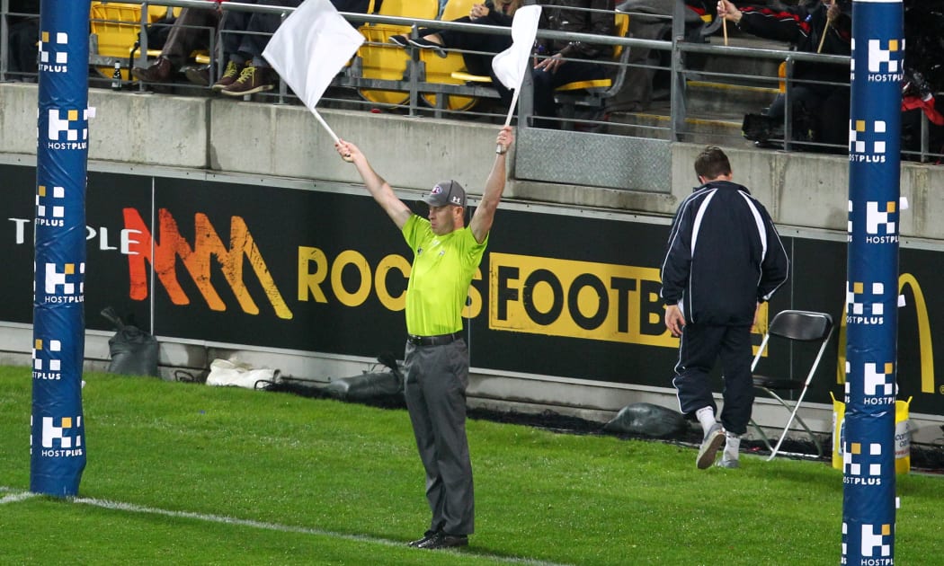 An AFL referee in action