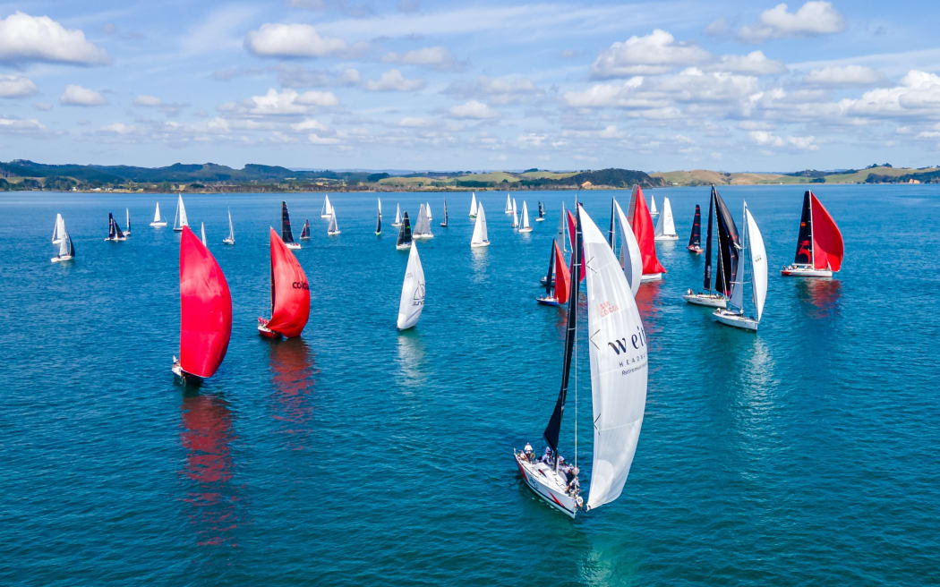 Sails crowd the water at the start of the island racing event during Bay of Islands Sailing Week 2024.